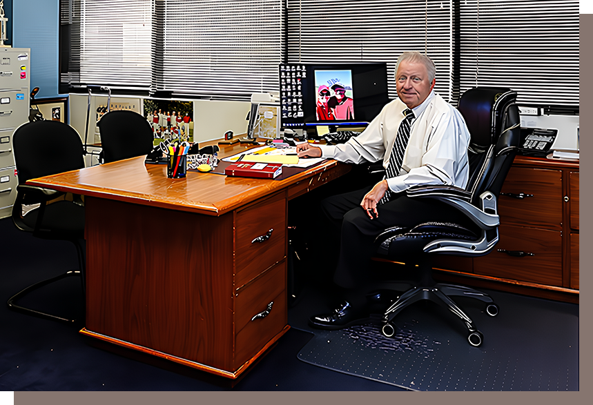 A man sitting at his desk in an office.