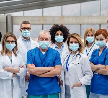 A group of medical professionals wearing surgical masks.